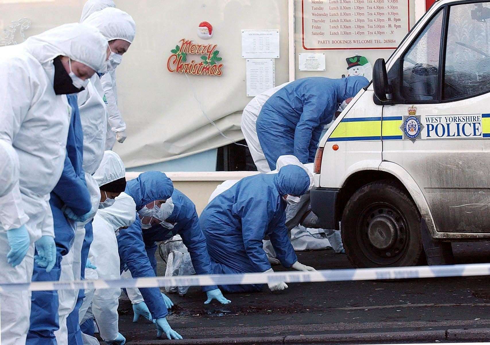 Forensic officers search the scene after the 2003 murder in Dib Lane, Leeds (John Giles/PA)