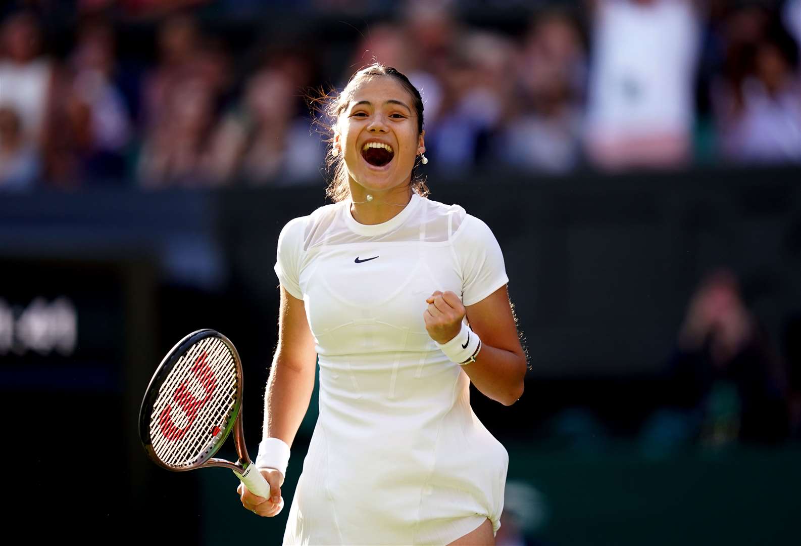 Emma Raducanu celebrates victory over Alison Van Uytvanck on day one of the 2022 Wimbledon Championships (Adam Davy/PA).