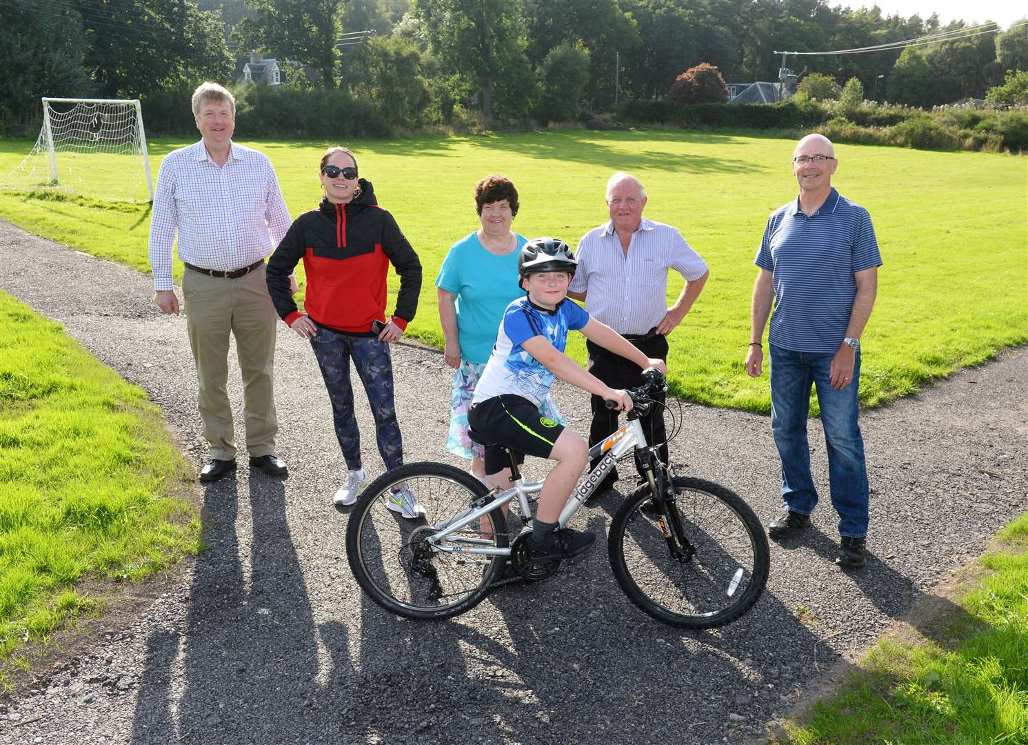 Young cyclist Maximus Ireland with residents Alec Rose,Camilla Ireland,Gladys and Sandy Maclean and Rob Clarke. Picture Gary Anthony.