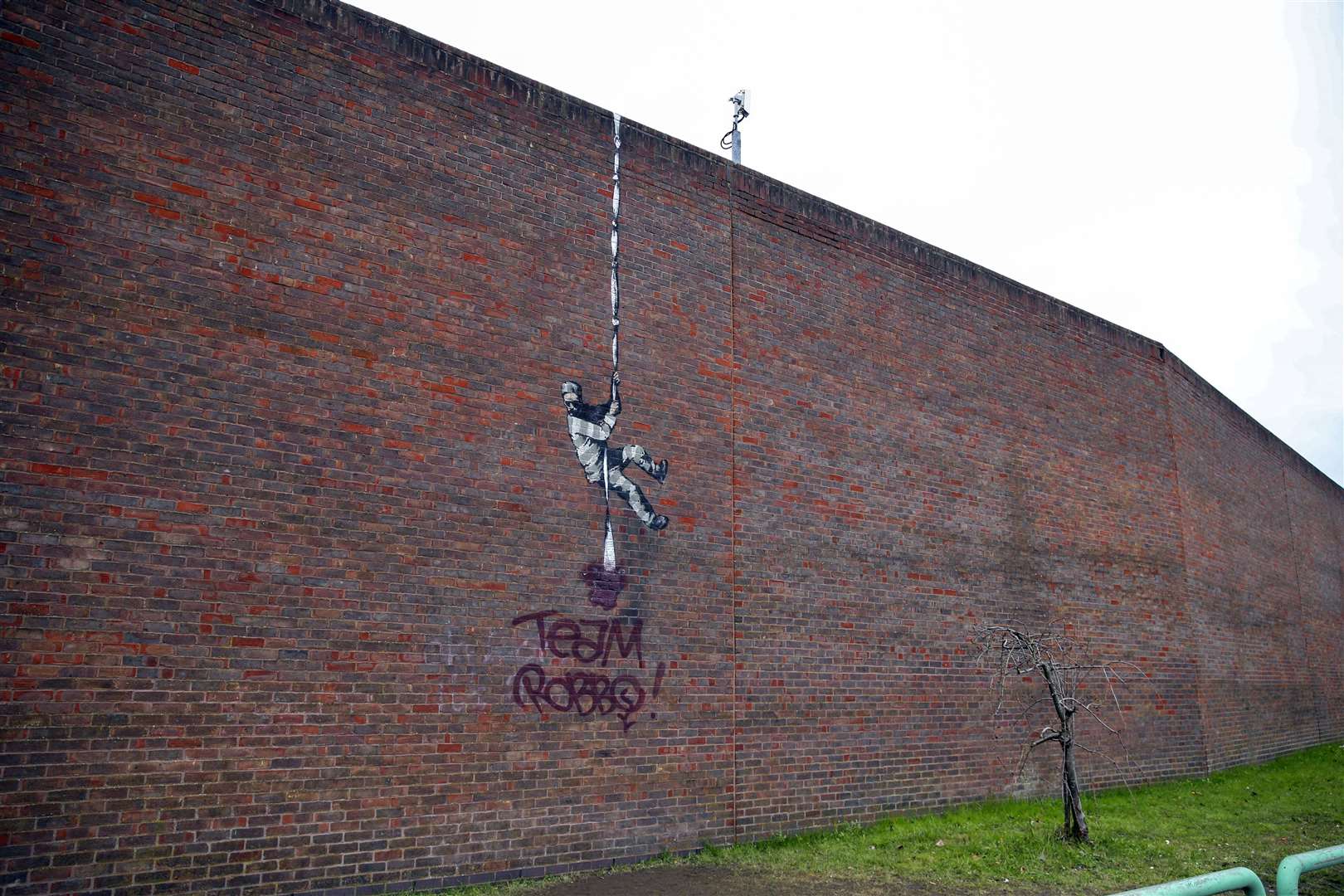 The Banksy artwork was painted on the side of the former prison in Reading (Steve Parsons/PA)