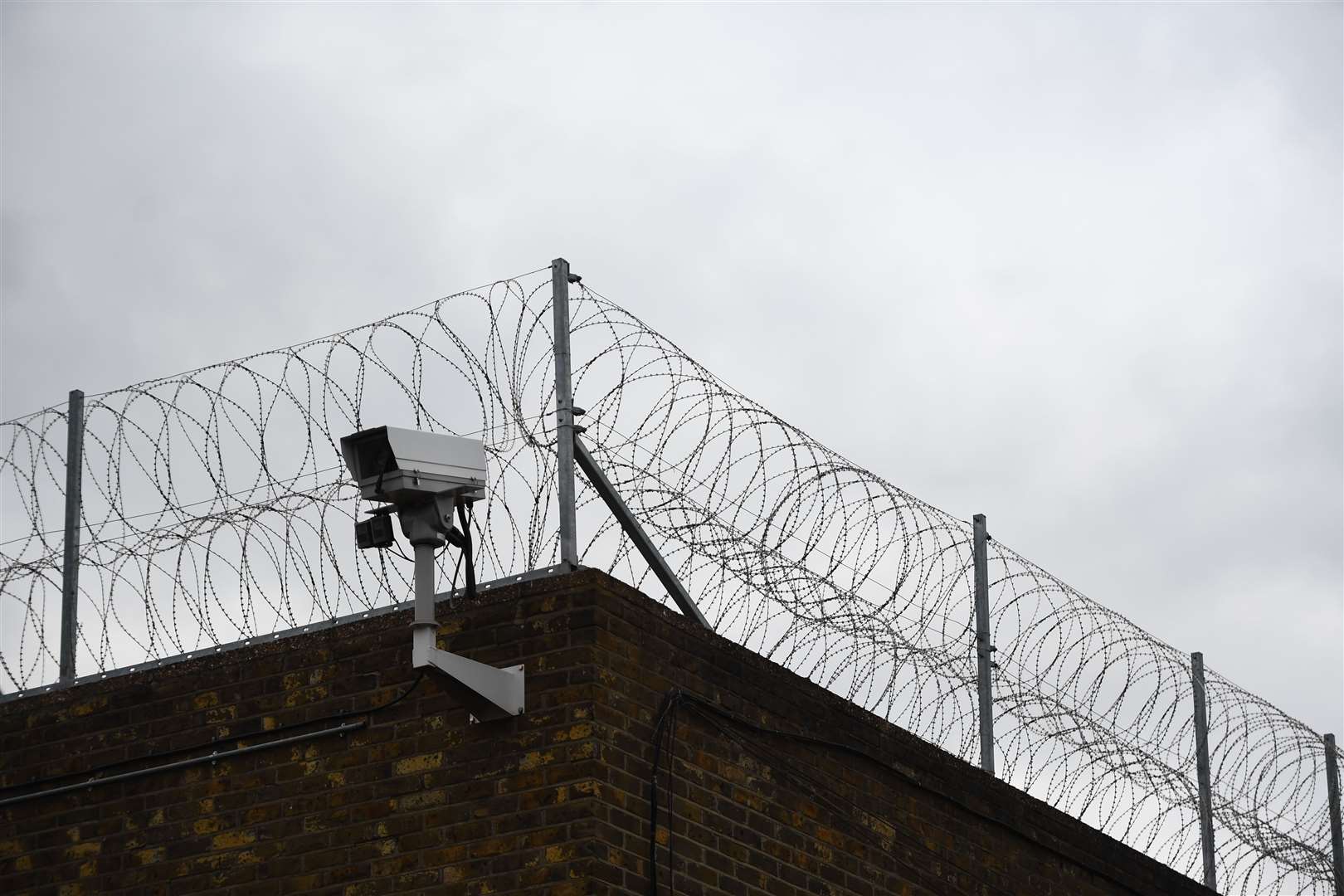 Barbed wire on a prison wall (Victoria Jones/PA)