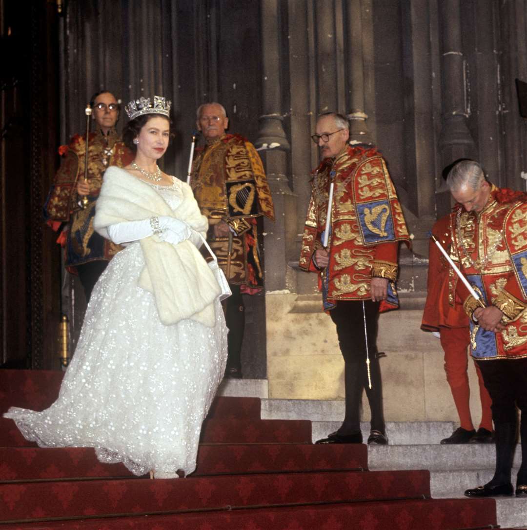 The Queen leaving the Palace of Westminster after the State Opening of Parliament in 1964 (PA)