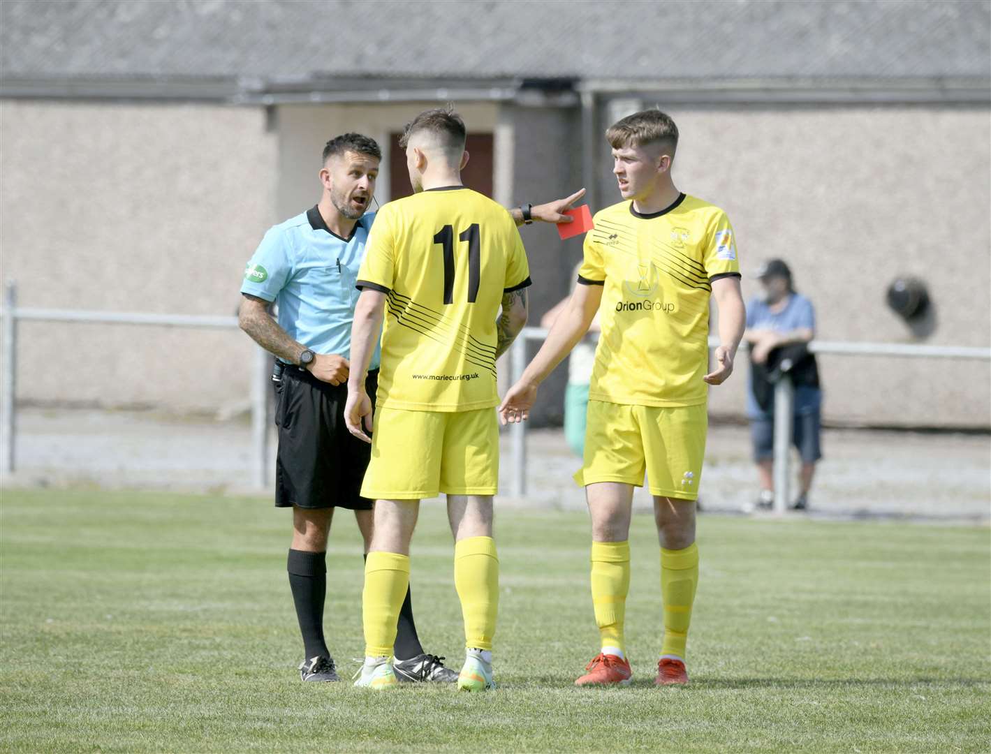 Clach's Paul Brindle receives the only red card of the game...Keith FC v Clachnacuddin FC...Picture: Beth Taylor.