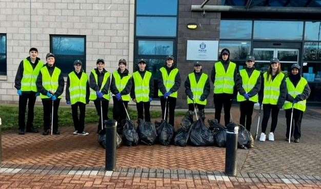 The community-spirited volunteers outside Police Scotland's Inverness HQ n Inshes with the bags of rubbish they collected. Picture: Police Scotland.