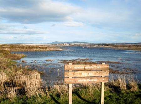 The wildlife trust reserve sign at the car park in Kingston at the mouth of the Spey.