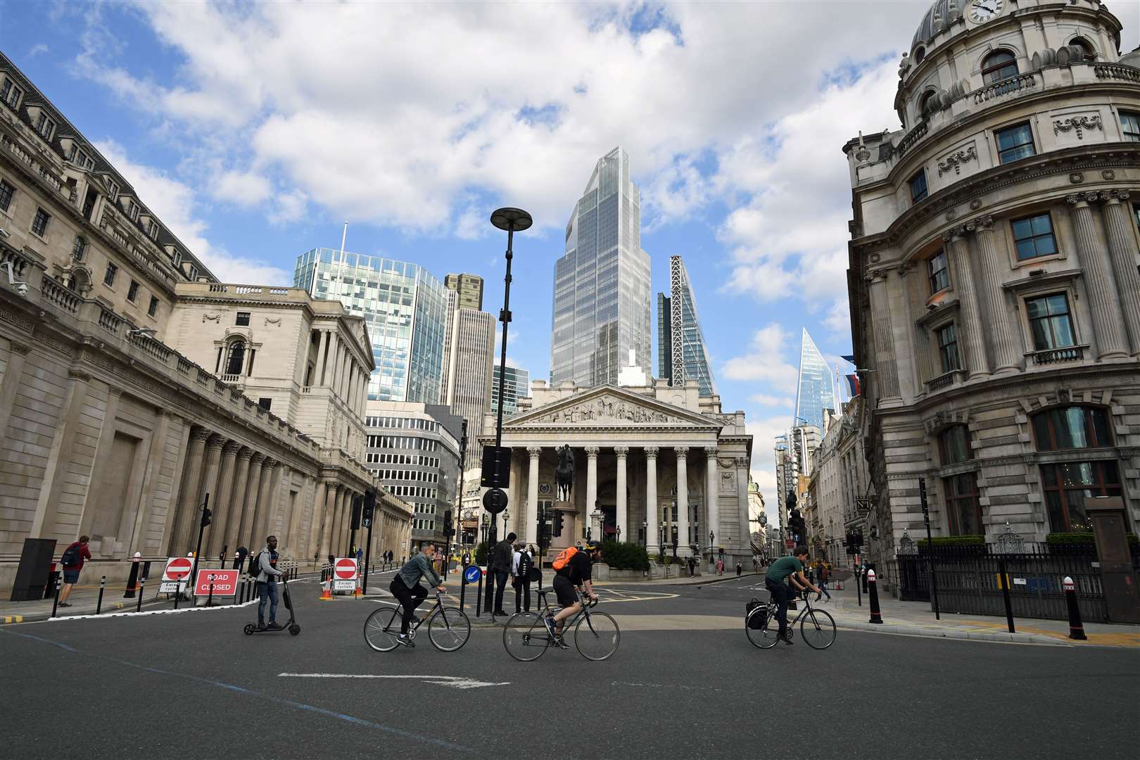 Cyclists cross a quiet Bank Junction near the Bank of England in the City of London (Stefan Rousseau/PA)