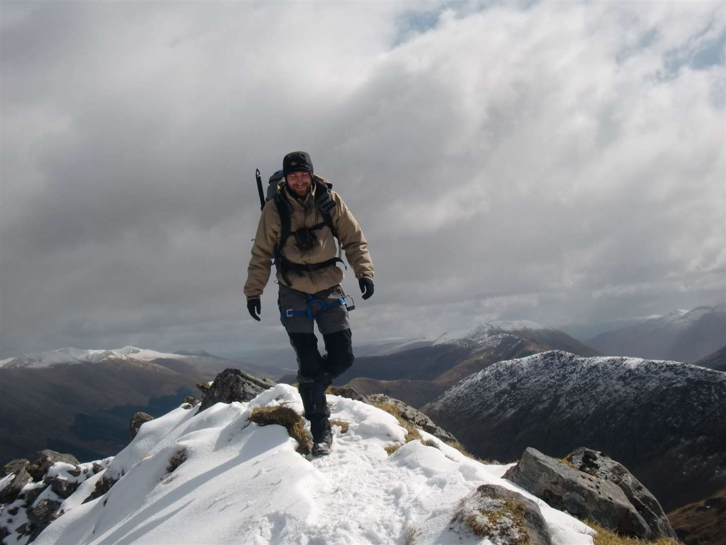 John crosses a snowy patch on the upper part of the Forcan Ridge.