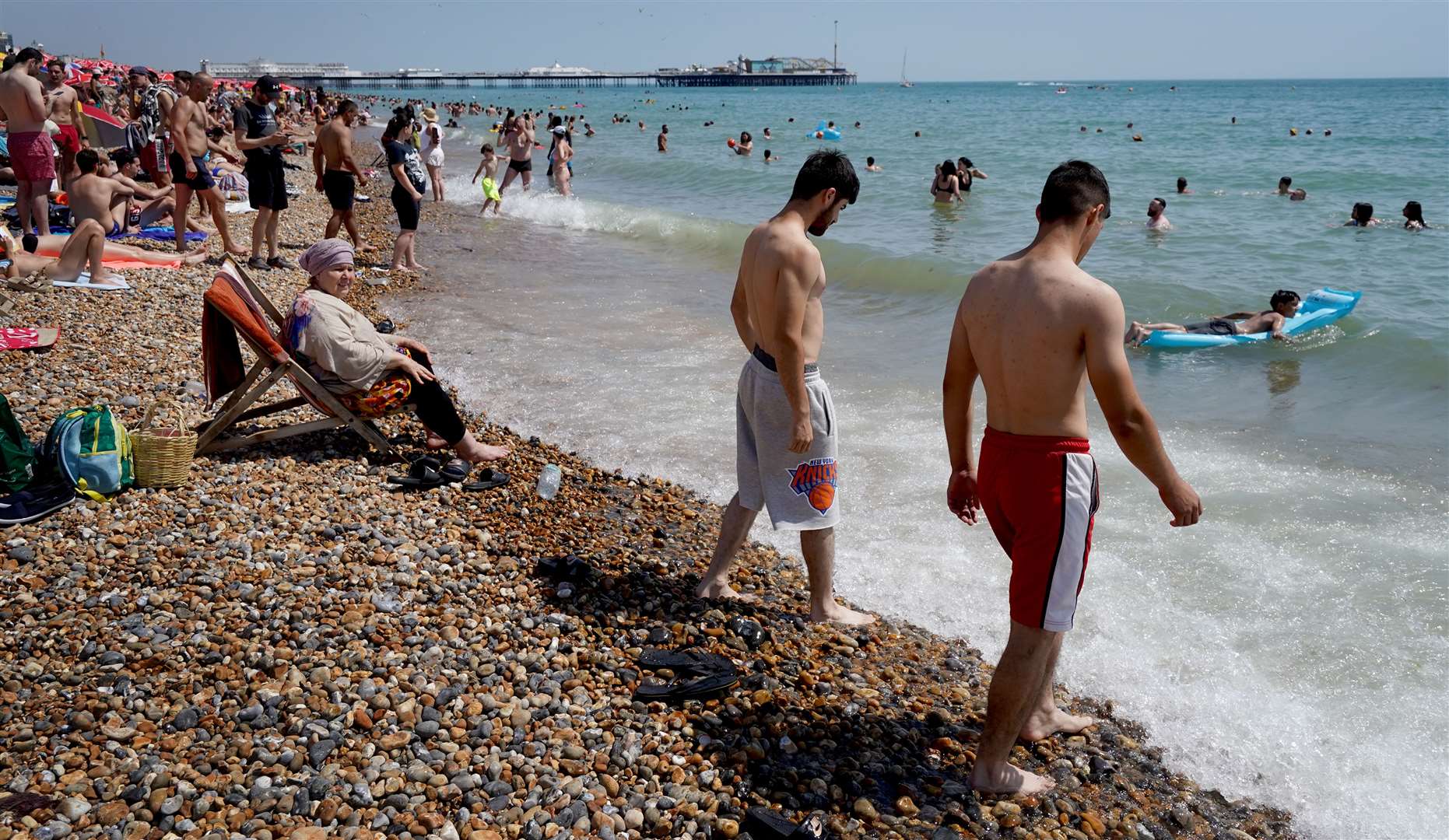 People on the beach in Brighton, East Sussex (Gareth Fuller/PA)