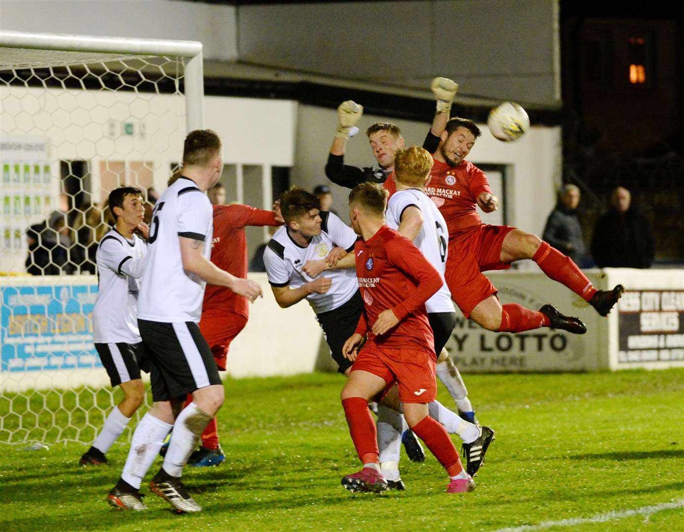 Clach v Brora at Grant Street Park..Neil MacDonald rises as keeper Ryan Hunter closes in...Picture: Gary Anthony. Image No..