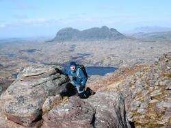 Peter Evans on the descent from Cul Mor with Suilven in the background.