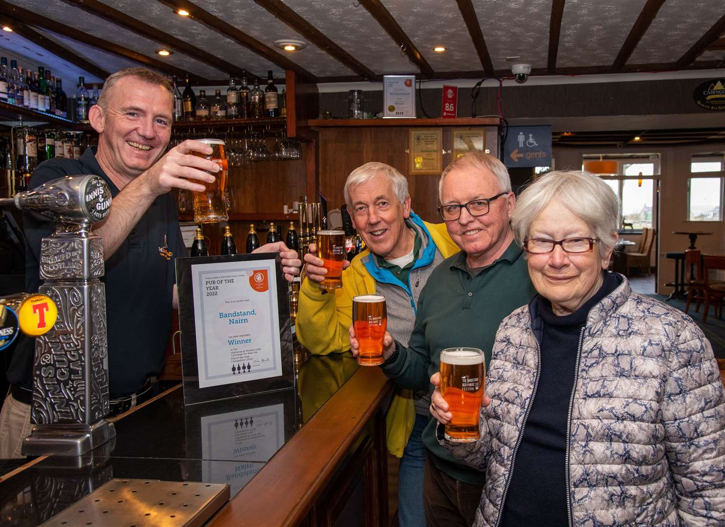 From Left: Paul Geddes, CAMRA Highalnds and Islands Chairman Jim Hall and loyal customers Andrew Gardener and Elizabeth Bligh.