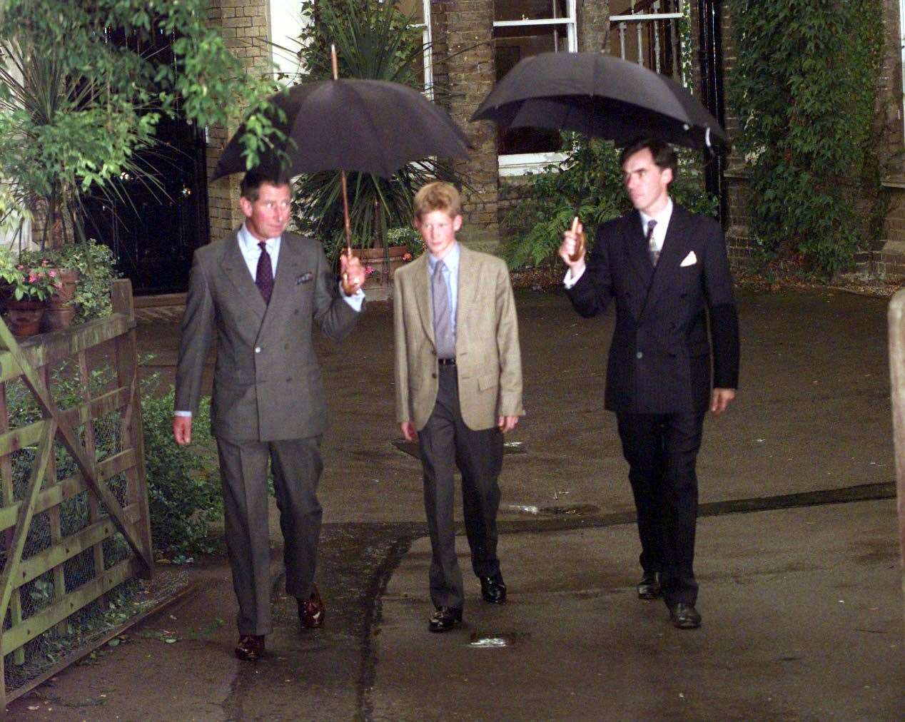 Harry (now the Duke of Sussex) and the Prince of Wales (now King Charles III) at Eton College, Berkshire, on his first day joining the school as a boarder in 1998 (Stefan Rousseau/PA)