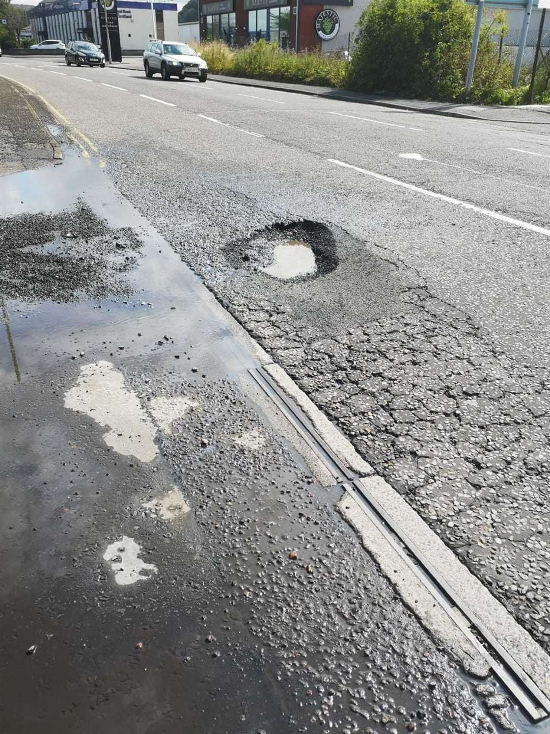 Pothole on Harbour Road before the repair.