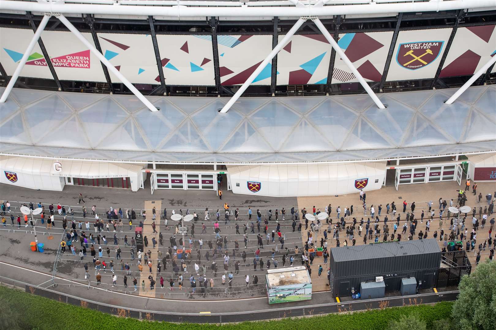 People queue outside an NHS Vaccination Clinic at West Ham’s London Stadium in Stratford, east London. (Dominic Lipinski/PA)