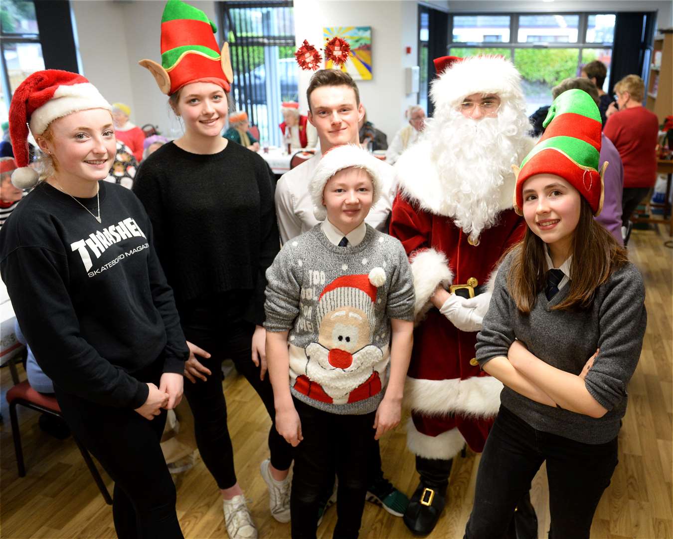 Pupils of Fortrose Academy came along to help with serving lunch and chatting with the seniors. Picture: Gary Anthony.