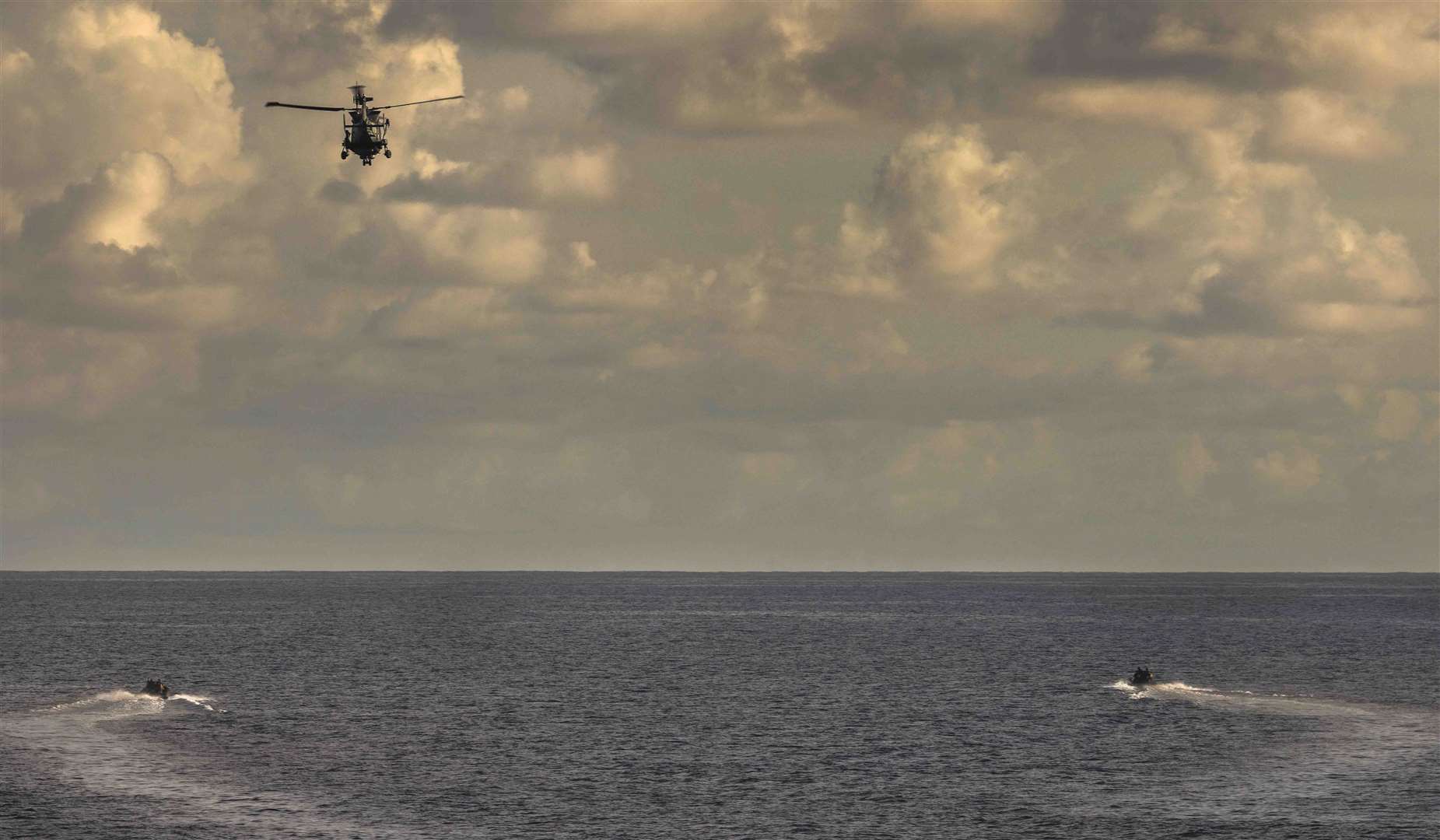 HMS Dauntless’ embarked Wildcat helicopter launches with two sea boats to intercept and apprehend a suspect vessel (LPhot Dan Rosenbaum/MoD/Crown Copyright/PA)