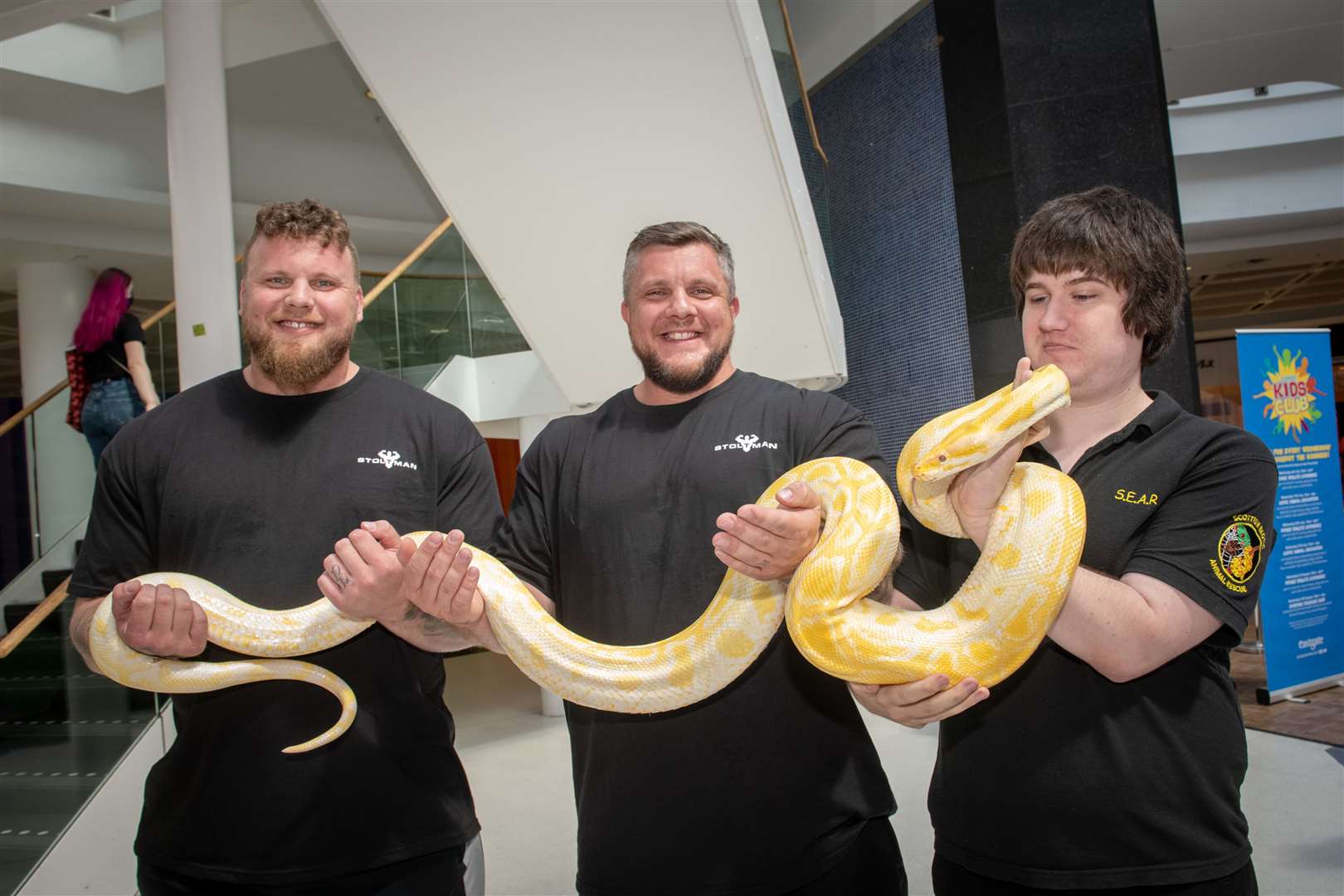 World's Strongest Man and Europe's Strongest Man Tom Stoltman and Luke Stoltman with Scottish Exotic Animal Rescue Manager Chris Evans. Picture: Callum Mackay.