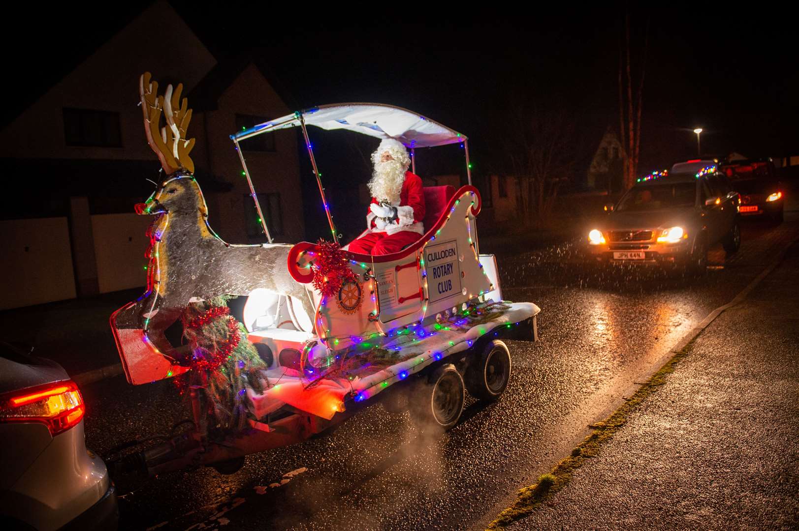 Santa makes socially-distance visits around Inverness on his sleigh.