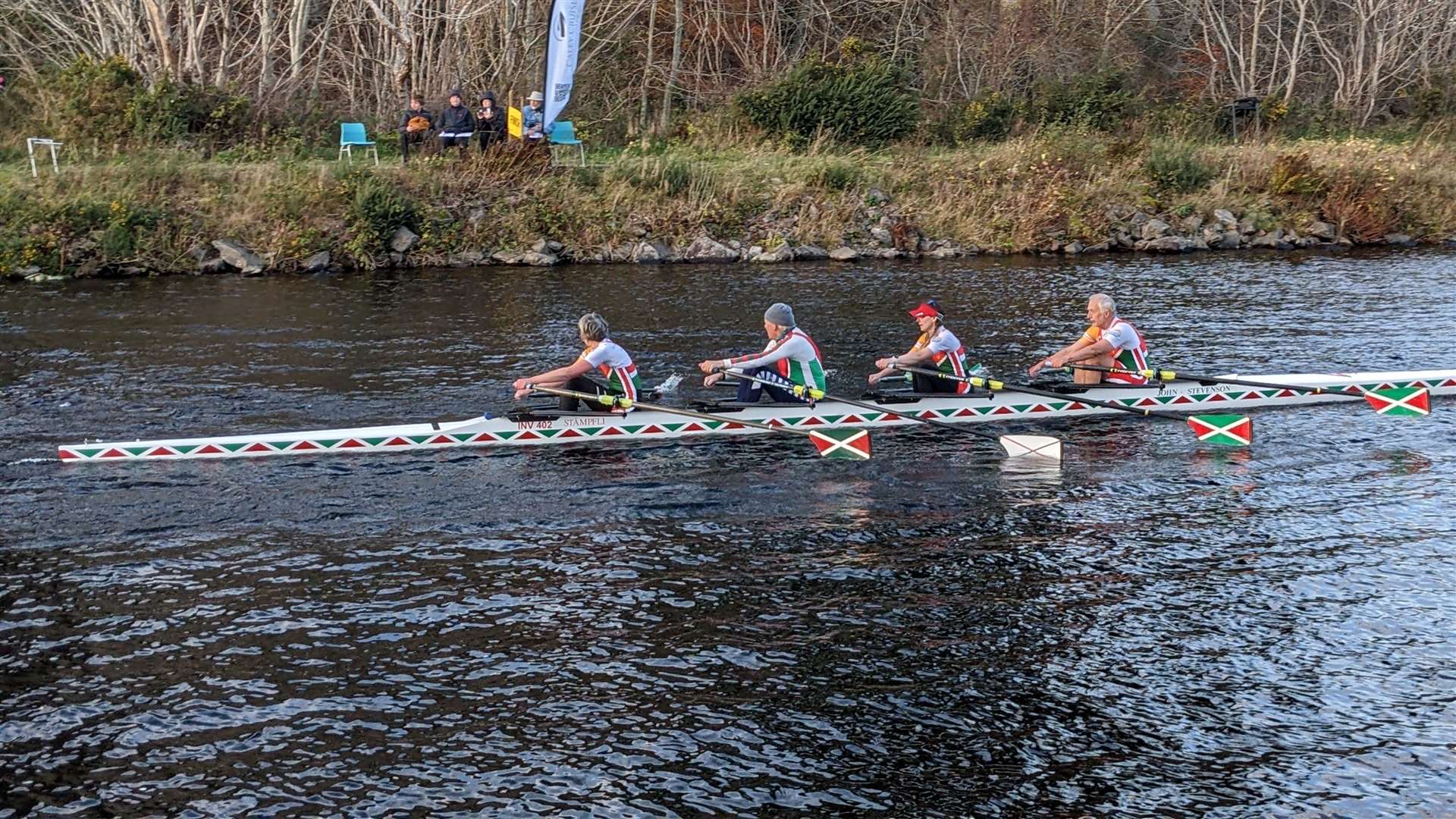 The winning Inverness Mixed Masters Quadruple Sculls crew crossing the finishing line - Dave Rotherwell at bow, Julie Fowlis at two, Tom Baker at three and Jude McManus in the stroke seat.