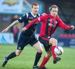 Ross County's Scott Boyd and St Johnstone's Stevie May in action last season.