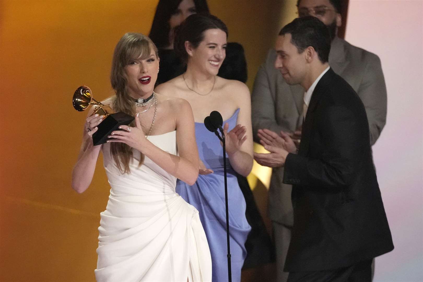 Taylor Swift accepts the award for album of the year for Midnights during the 66th annual Grammy Awards on Sunday (Chris Pizzello/AP)