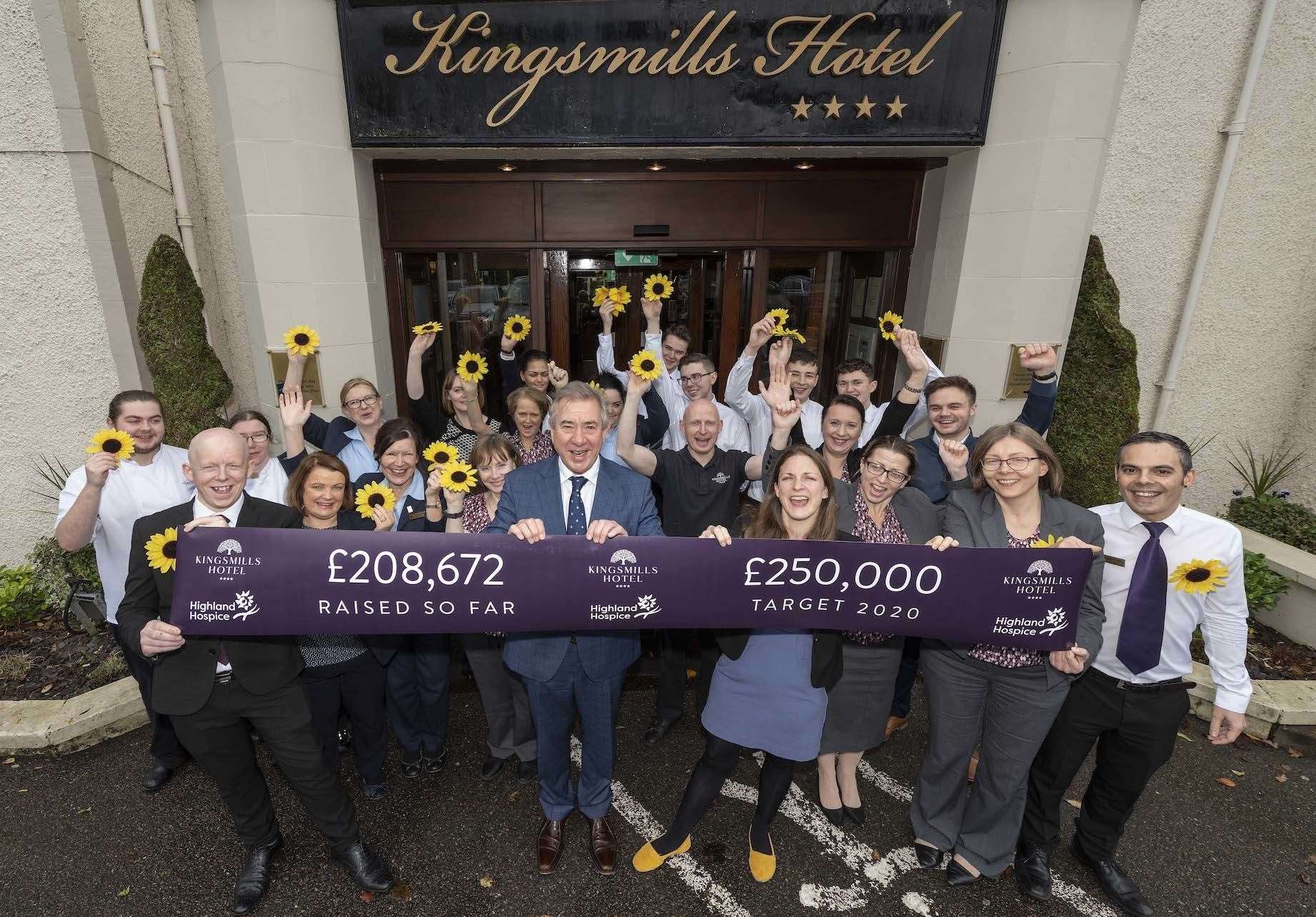 Kingsmills Hotel Group staff, including chief executive Tony Story (centre) celebrate supporting Highland Hospice.