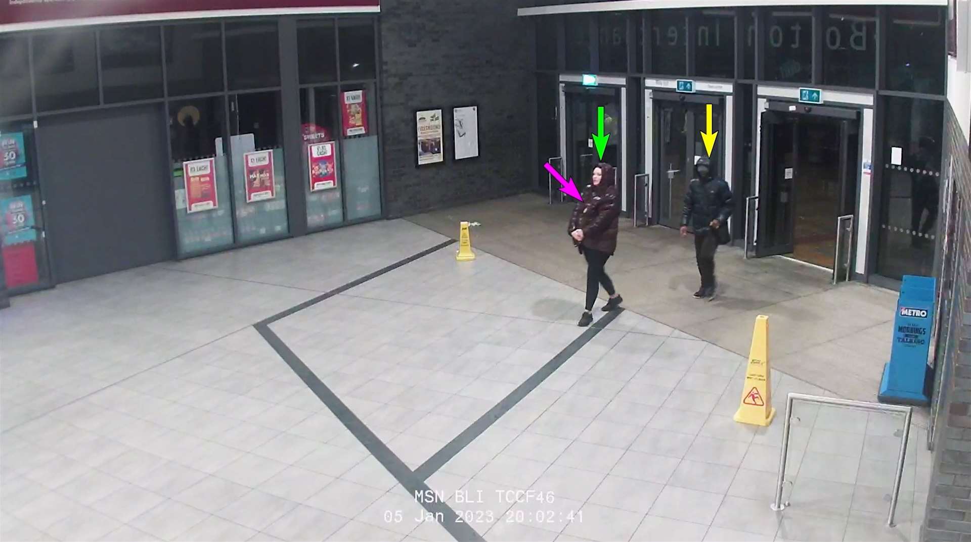Marten (green arrow) and Gordon (yellow arrow) allegedly walked into Bolton bus interchange with the baby (pink arrow) under Marten’s coat on January 5 2023 (Met Police/PA)