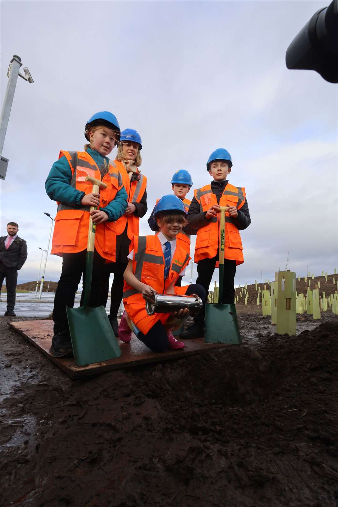 Croy Primary School Children digging a hole fot the time capsule at Inverness Airport Train Station. Picture: James Mackenzie.