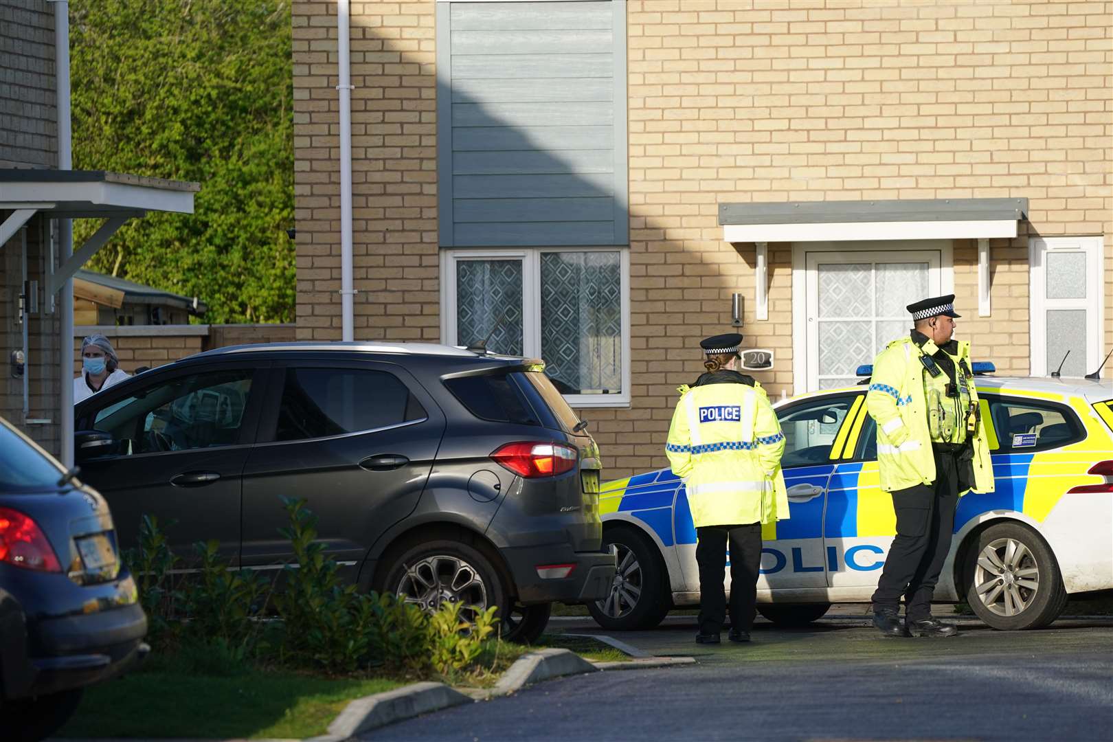 Police at the scene in Meridian Close, Bluntisham, Cambridgeshire, where police found the body of a 32-year-old man with a gunshot wound on Wednesday evening (Joe Giddens/PA)