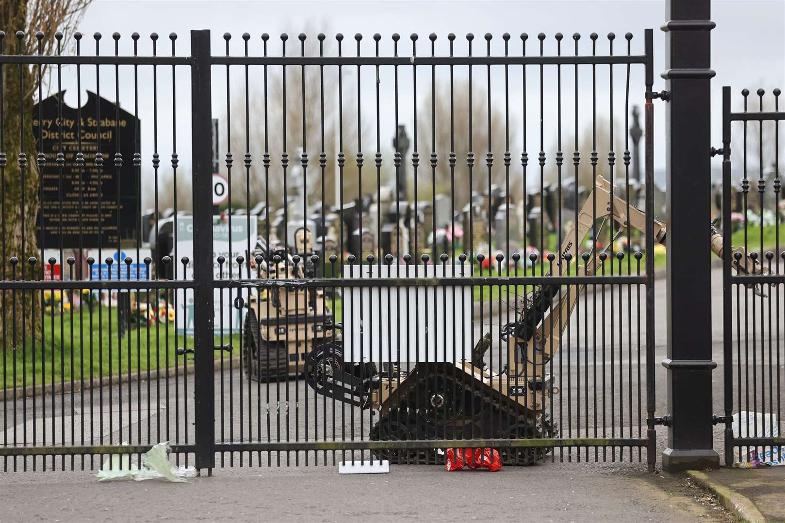 Robots examine the scene at Derry City Cemetery (Liam McBurney/PA)