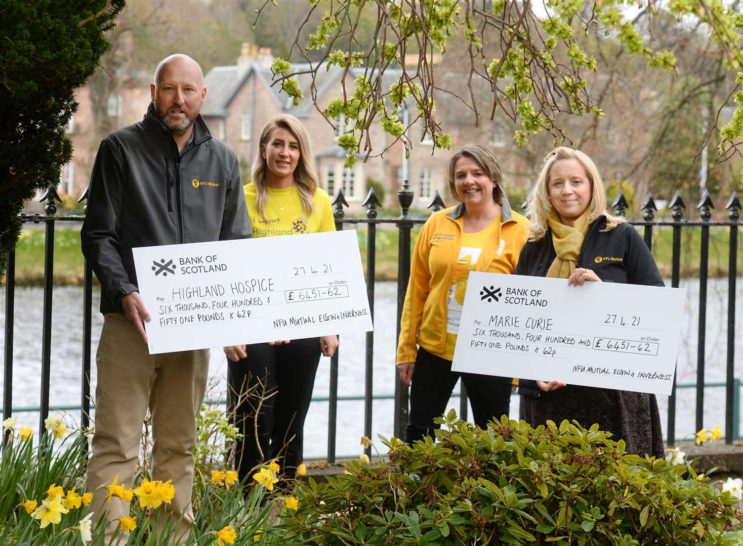 Malcolm Mackenzie and Rachael Snody-Scott (right) of NFU Mutual Insurance present their cheques to Karen Duff of Highland Hospice and Vonnie Stevenson of Marie Curie.