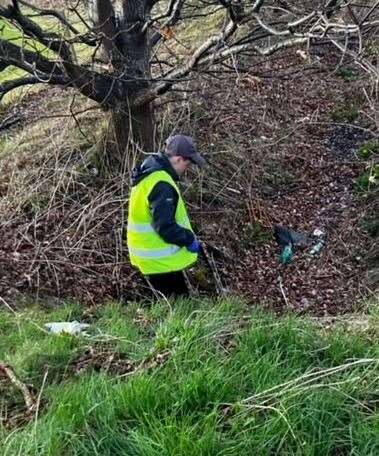 The young volunteers took to open spaces in Inshes to help clean up the local community. Picture: Police Scotland.