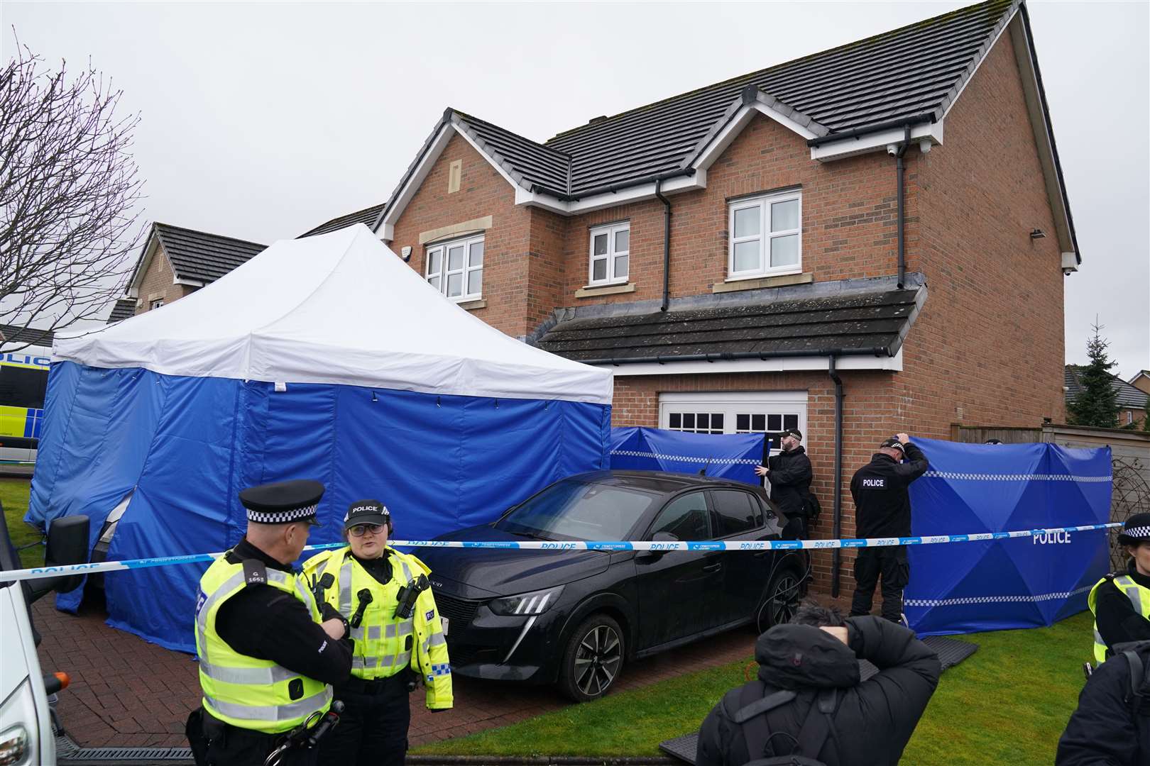 The image of a police tent on the lawn of the former first minister’s home was widely shared (Andrew Milligan/PA)