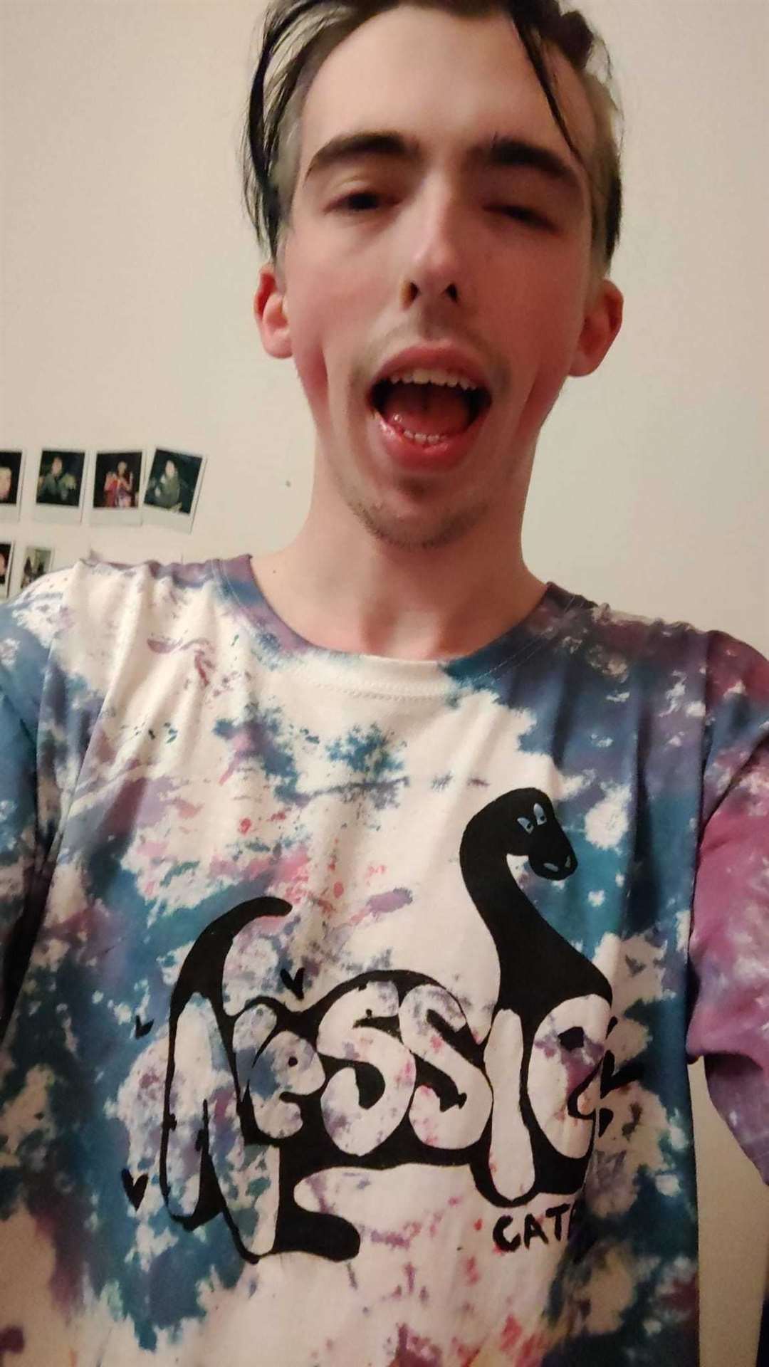 Guitarist Cam models one of the Nessie T-shirts the band has made.