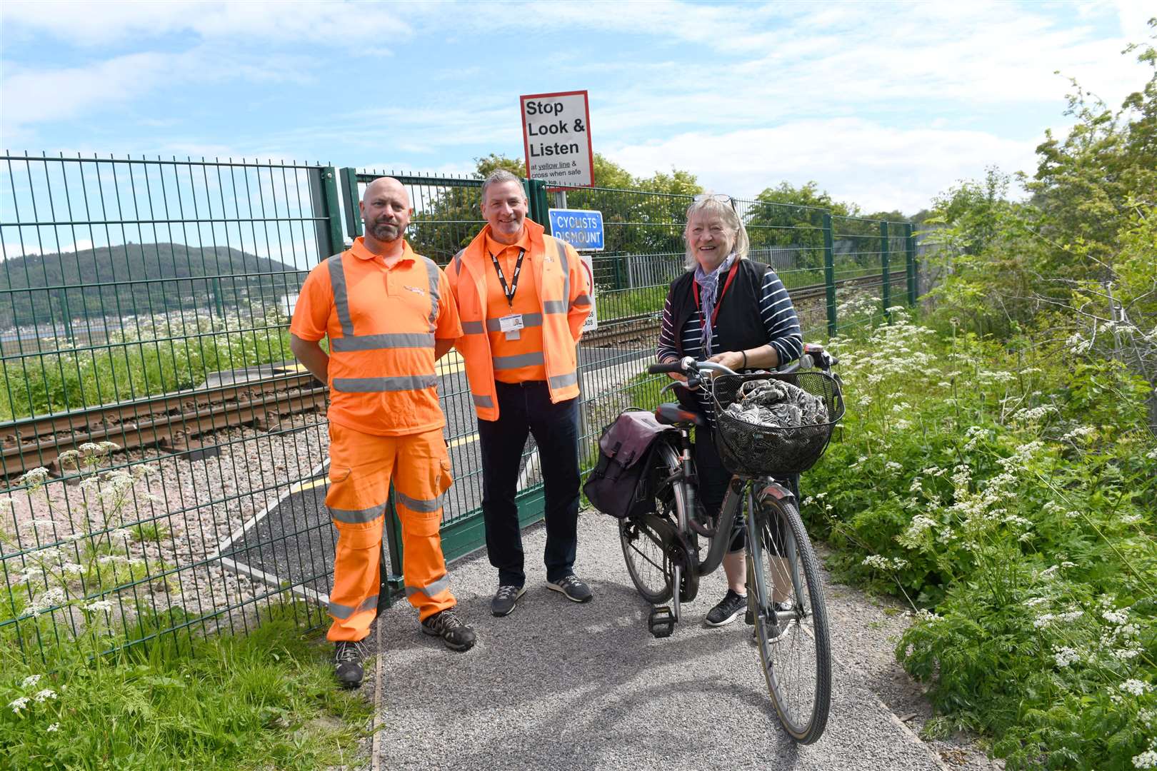 Merkinch Community Council chair Dell McClurg with railway officers.