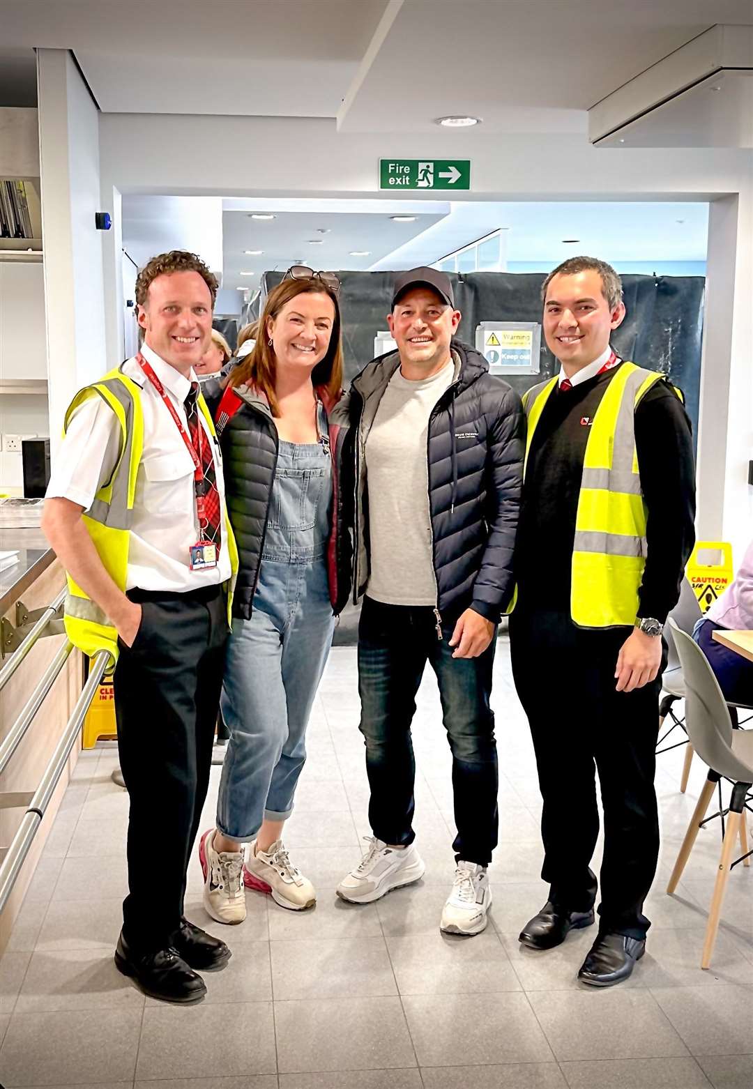 Loganair captain Daniel Tye, left, and first officer James Whitby, right, with Stephen McCann and Bridget Byrne (Stephen McCann/Big Partnership/PA)