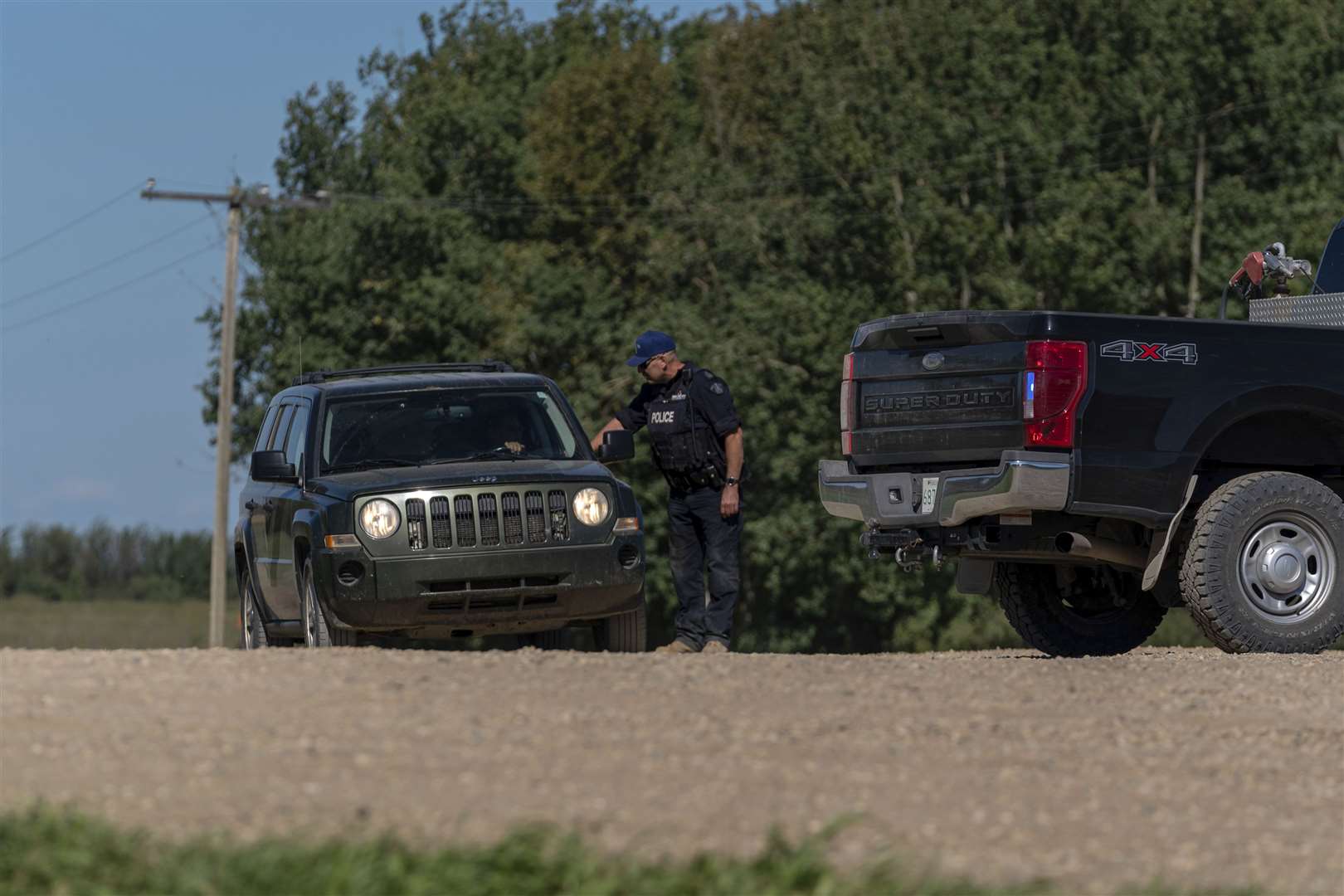An RCMP officer at a police road block in James Smith Cree Nation, Saskatchewan (Heywood Yu/The Canadian Press via AP)