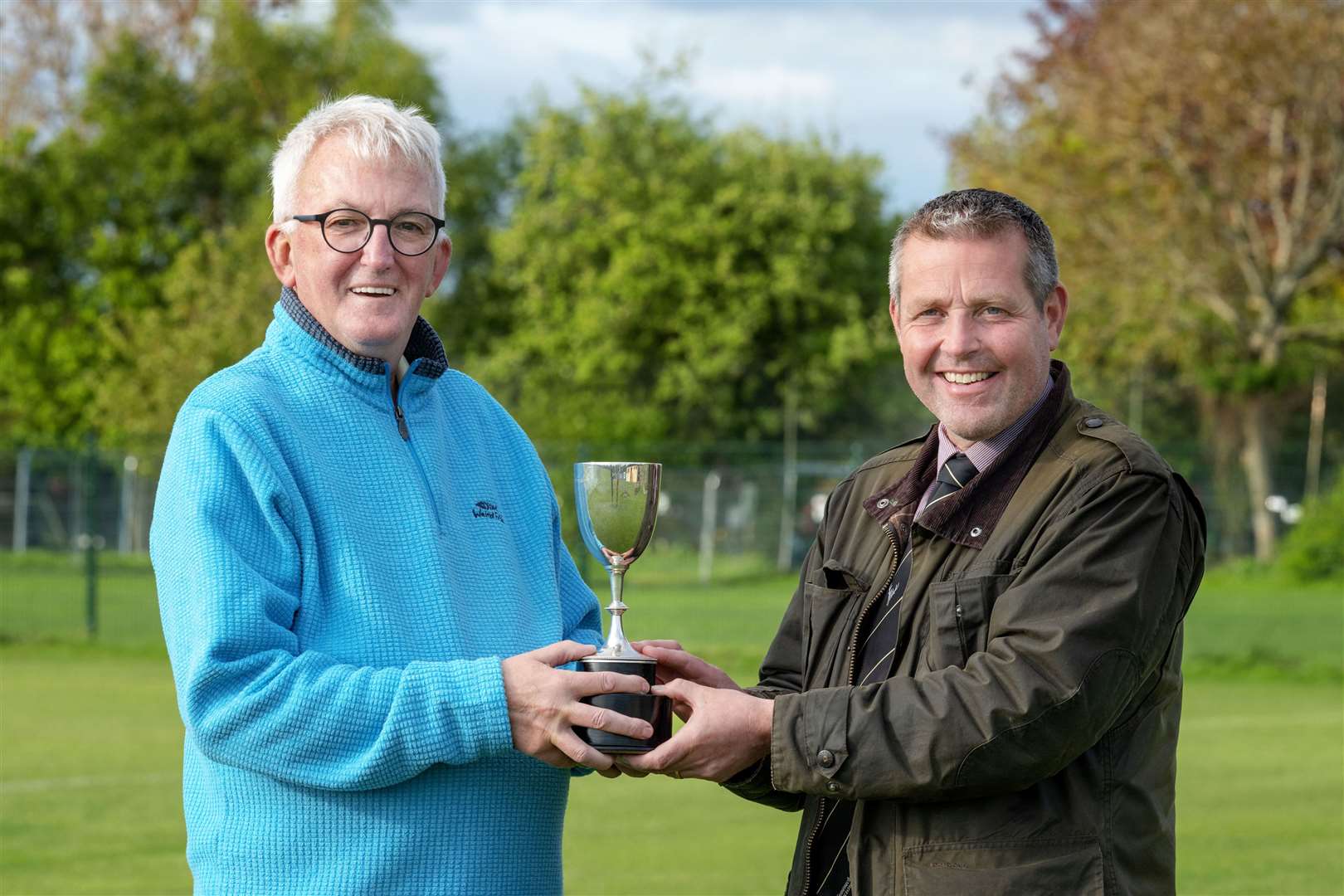 Earlier this year Hugh Dan MacLennan presented Camanachd Association president Steven MacKenzie with a trophy to be presented to the Sutherland Cup player of the match in the final. Picture: Neil Paterson
