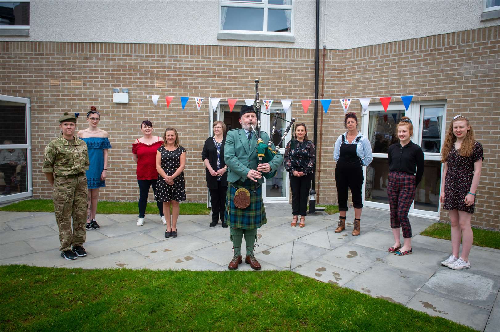 Piper Lewis Barclay with some of the staff at Castlehill House Care Home.