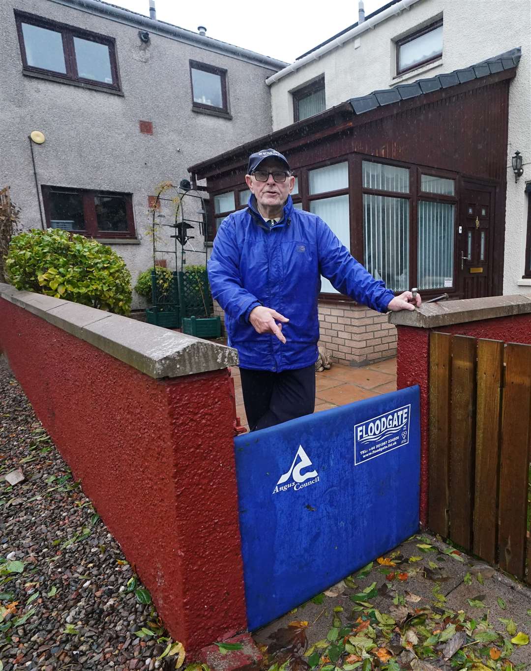 John Stewart with his flood defence outside his home in River Street, Brechin (Andrew Milligan/PA)