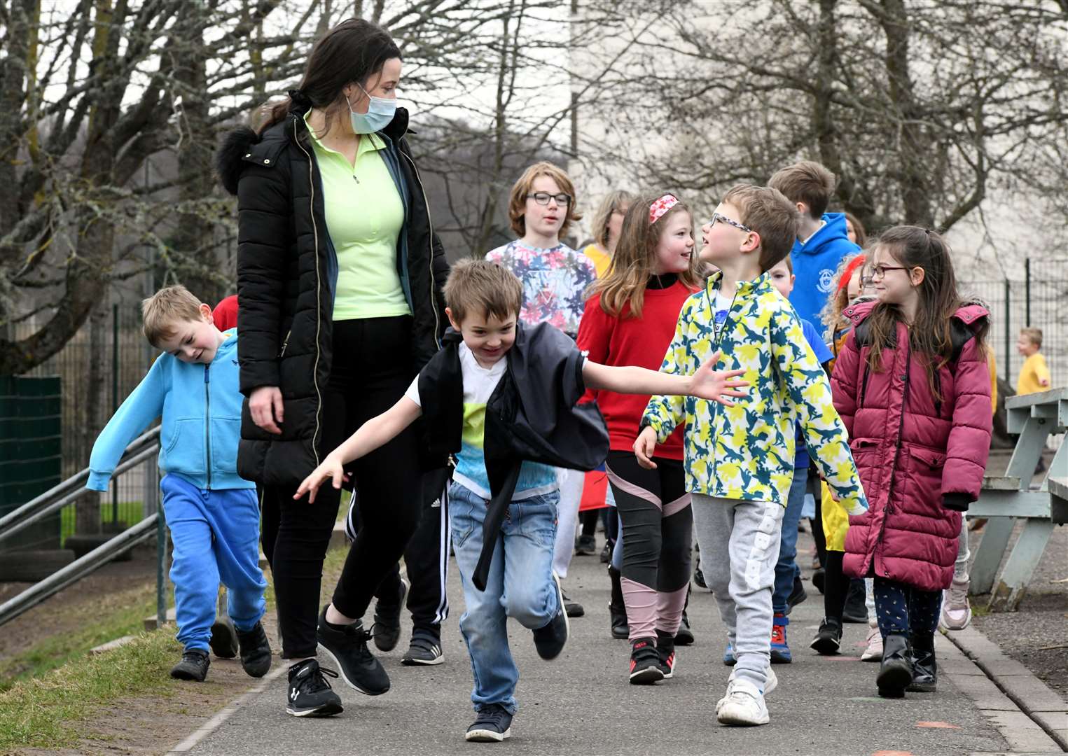 Children at Kinmylies Primary School wore the colours of the Ukrainian flag – yellow and blue – as part of a sponsored walk to help Ukraine. Some of the children had the energy to run. Picture: James Mackenzie