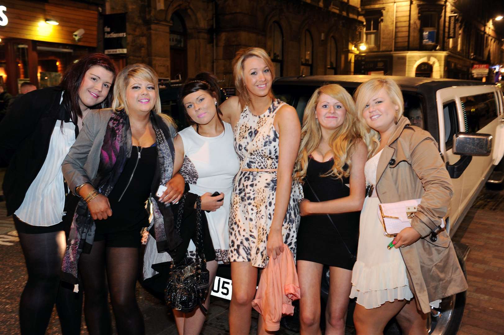 Arriving in town in a limousine is 21st birthday girl Amanda Christodoulatos (centre) with friends.