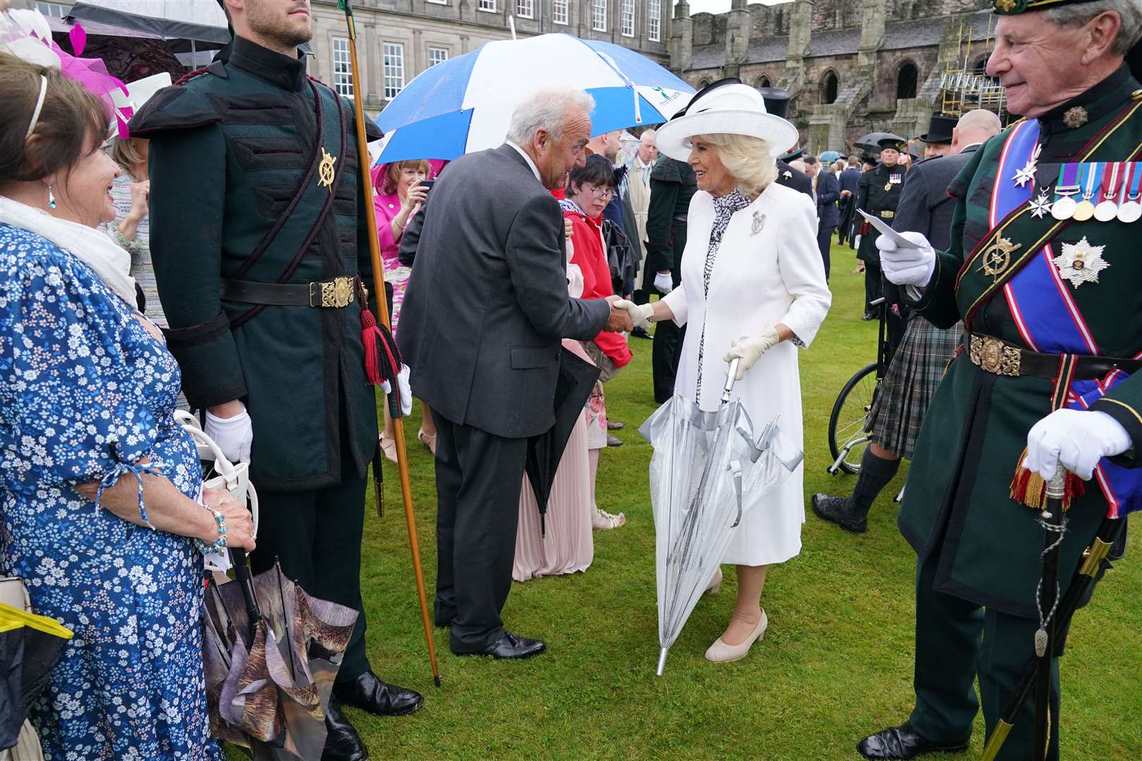 Queen Camilla greets guests during a garden party at the Palace of Holyroodhouse in Edinburgh (Jonathan Brady/PA)