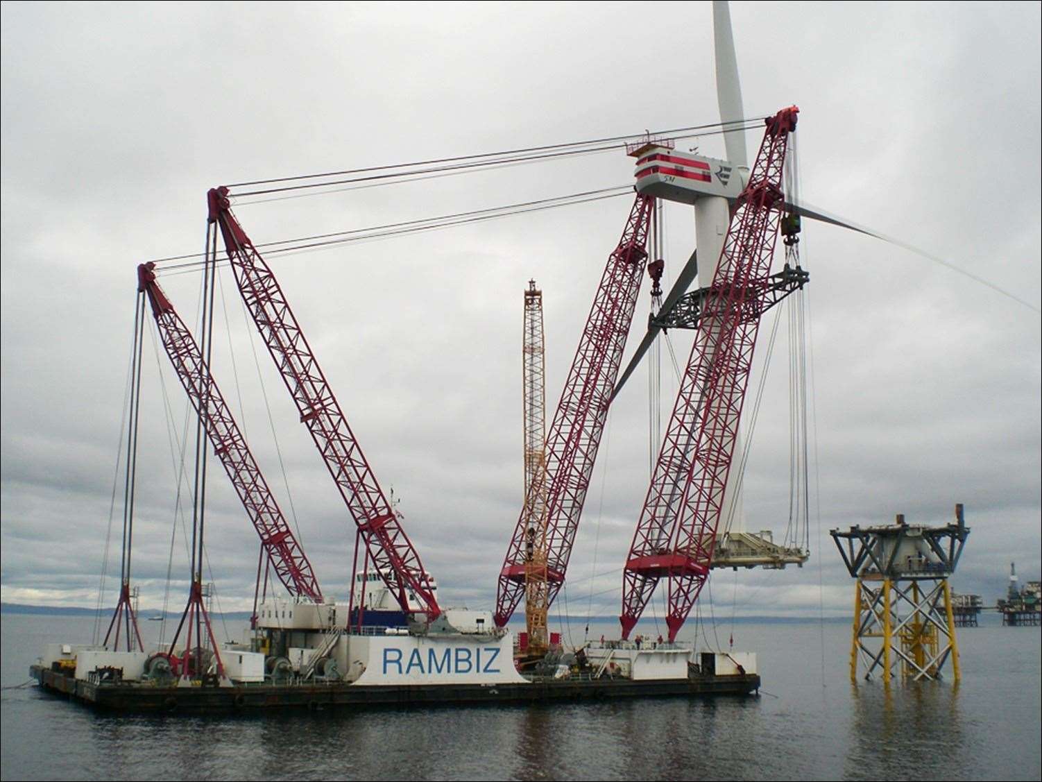 Offshore turbine being lifted into place at Beatrice offshore wind farm during construction.
