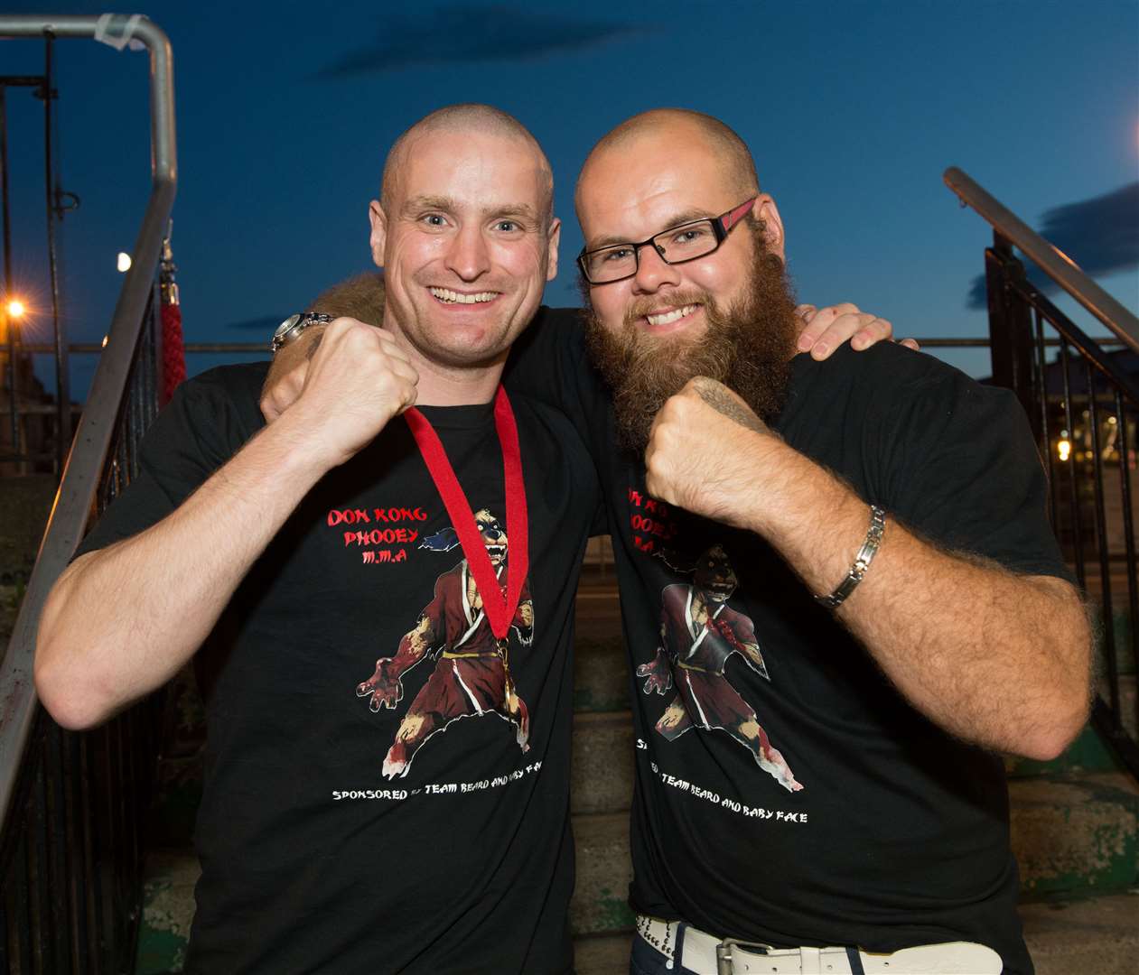 Mixed Martial Arts winner (left) Alexander Macdonald and and his corner man Steve McAngus. Picture: Callum Mackay.