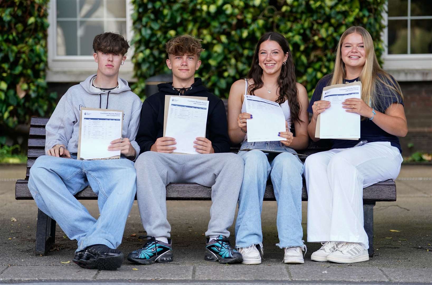 (left to right) James Smith, Elias Stisted, Katherine Edwards and Emily Farrar pose for a picture with their GCSE results (Andrew Matthews/PA)