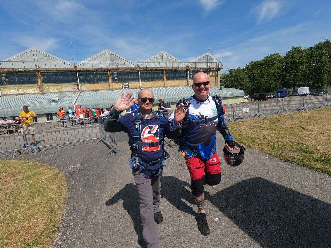 Mark and his tandem instructor heading to the plane (Army Parachute Association Netheravon/PA)