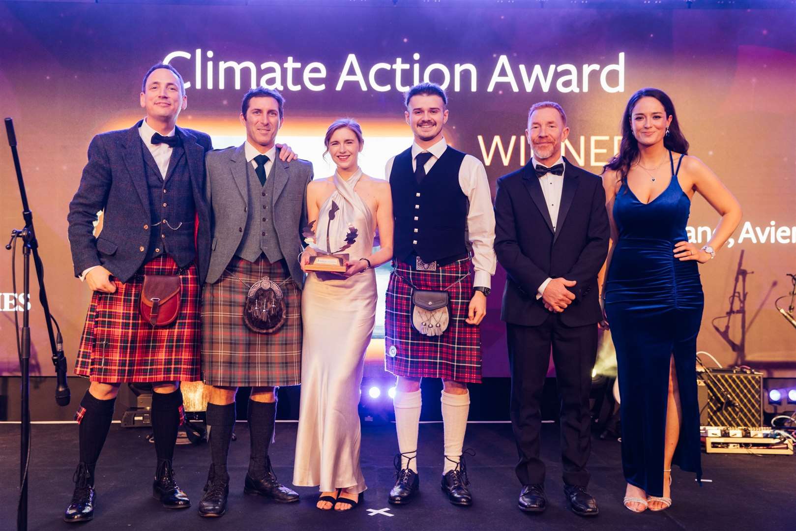 Presenter Gary Innes with Ben Thorburn, Emily Schaschke and Arran Goddard from Climate Action award winner, Wilderness Scotland, with Jeremy Lazell, Times Alba editor and presenter Jennifer Reoch. Picture: Connor Mollison