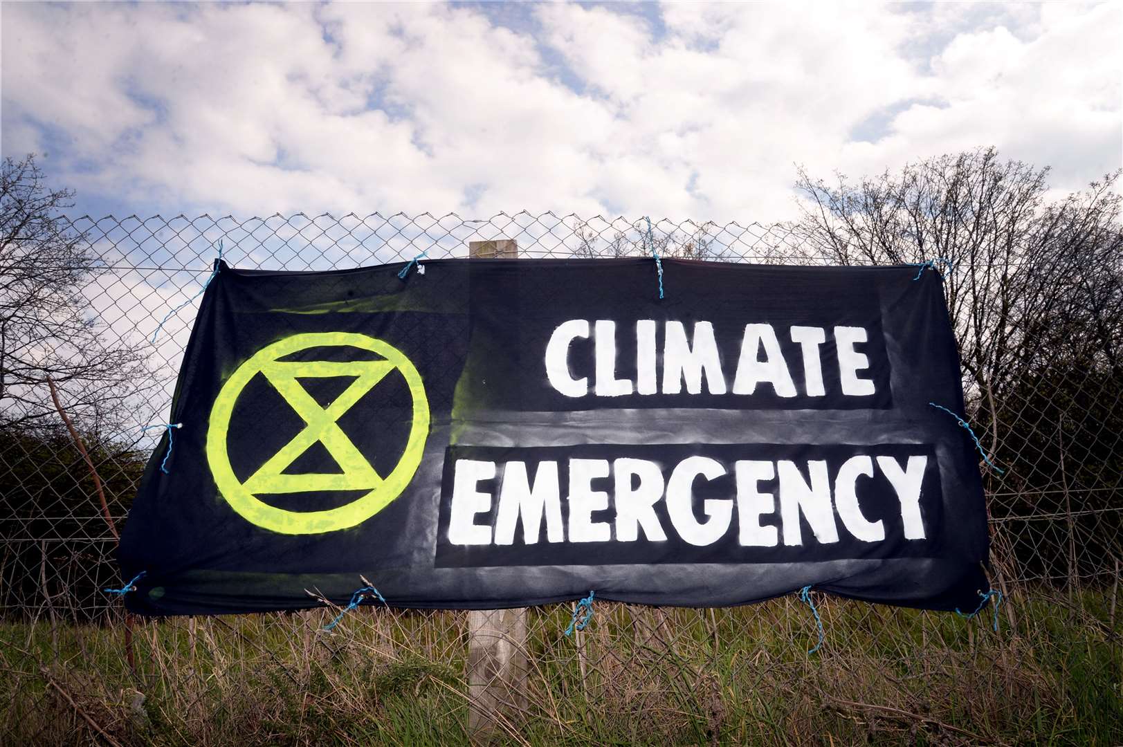 Extinction Rebellion protesters placed a banner at the Longman Roundabout in Inverness as part of their campaign. Picture: SPP