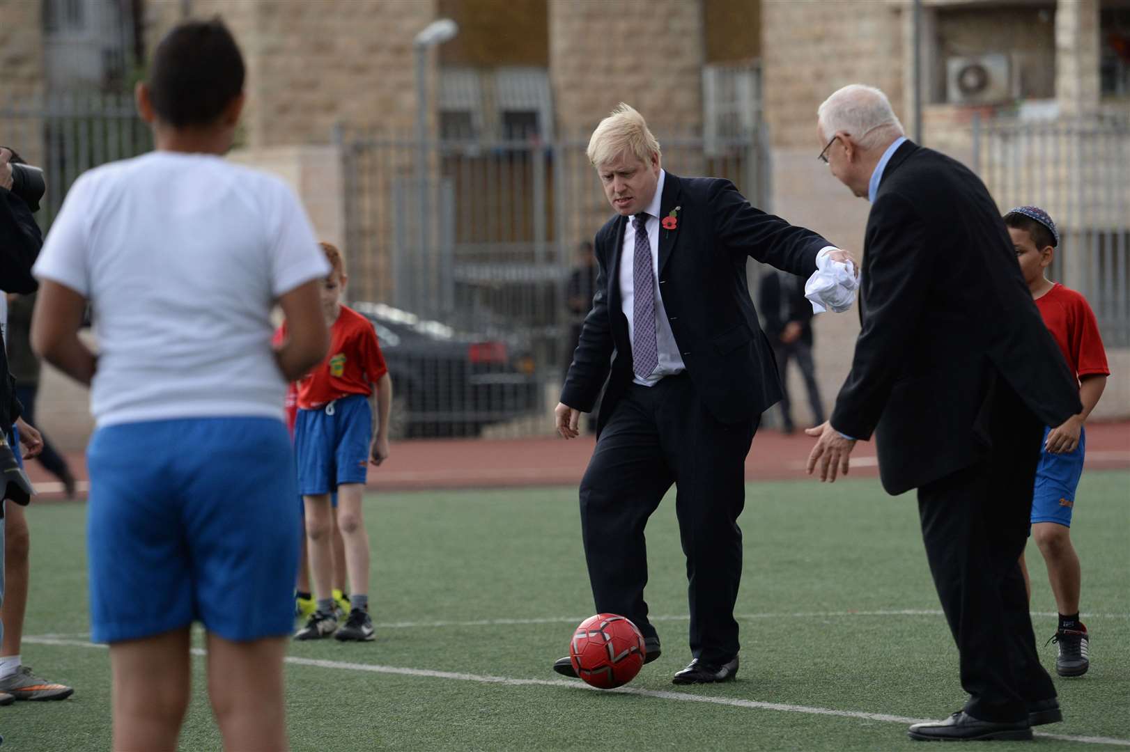 Even international opponents hold no fear for the PM, here Mr Johnson has a kick-about with Israeli president Reuven Rivlin in Jerusalem in 2015 (Stefan Rousseau/PA)